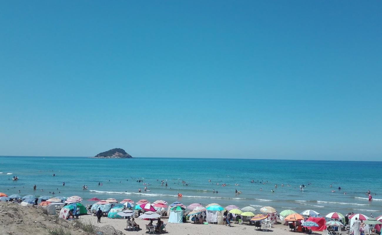 Awana Beach'in fotoğrafı bej kum ve kayalar yüzey ile