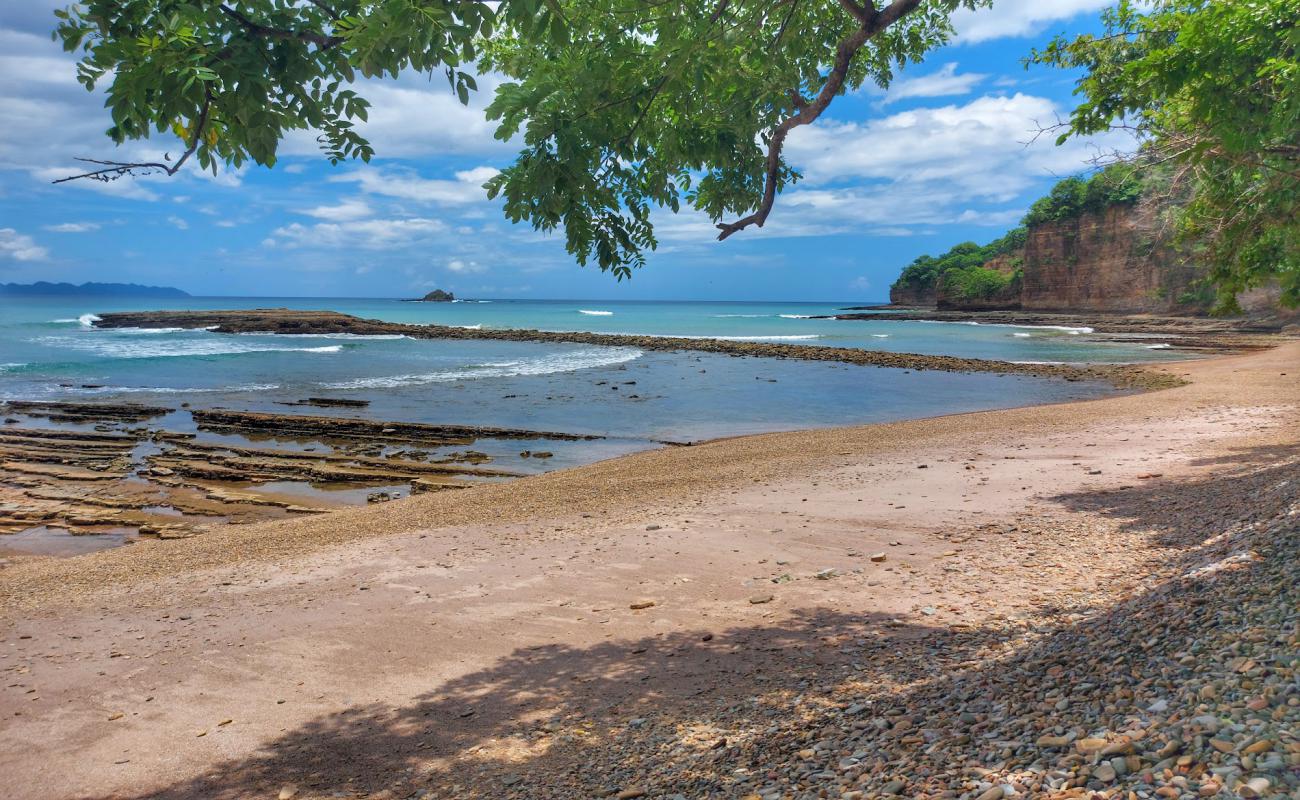 Punta Julian beach'in fotoğrafı gri çakıl taşı yüzey ile