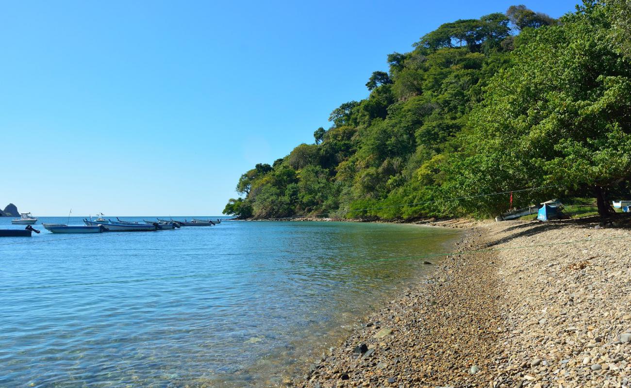 Curvo beach'in fotoğrafı gri kum ve çakıllar yüzey ile