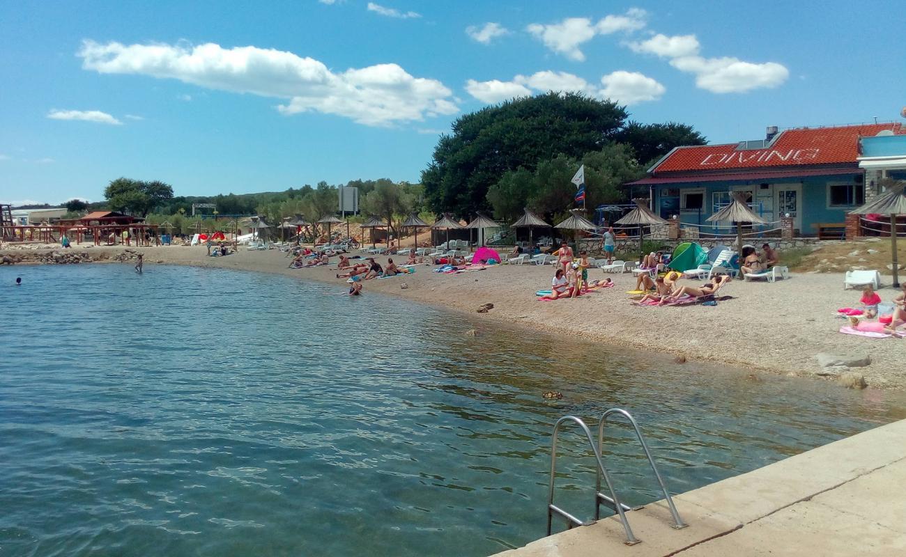 Dunat beach'in fotoğrafı bej çakıl yüzey ile