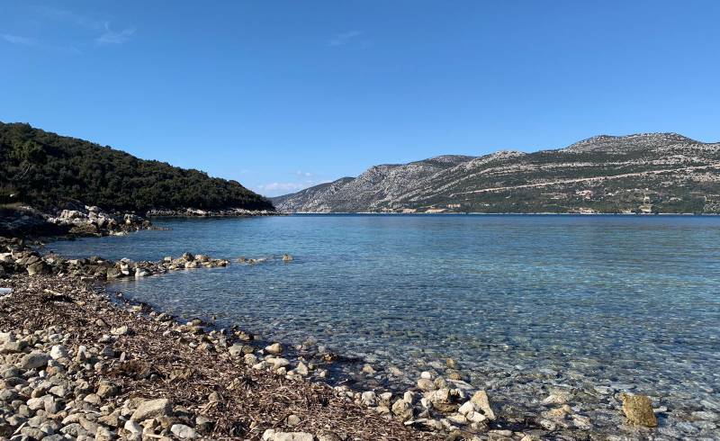 Korcula beach'in fotoğrafı hafif çakıl yüzey ile