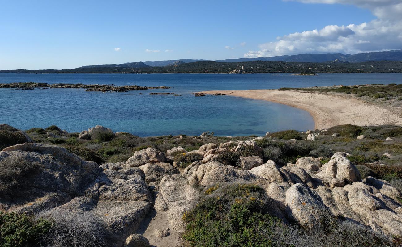 La Testa beach X'in fotoğrafı bej kum ve kayalar yüzey ile