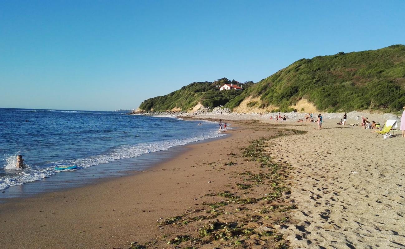 Plage de Senix'in fotoğrafı bej kum ve çakıl yüzey ile