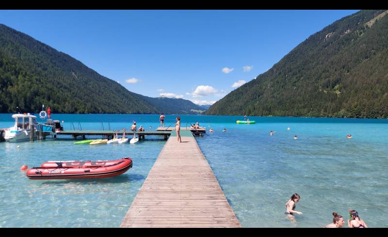 Freibad Weissensee'in fotoğrafı parlak kum yüzey ile