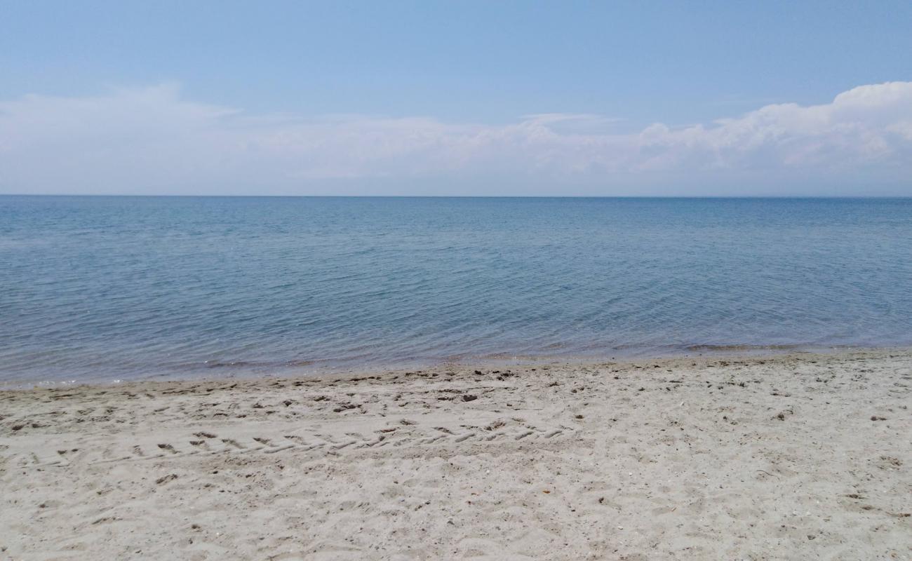 Kyma beach'in fotoğrafı bej kum ve çakıl yüzey ile