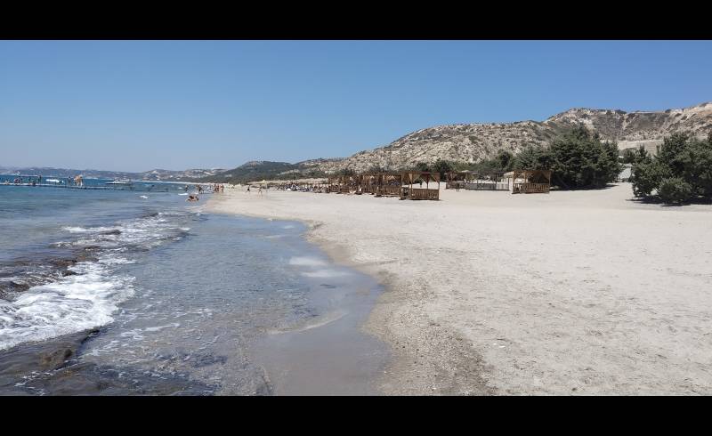 Blue Lagoon Beach'in fotoğrafı parlak kum yüzey ile