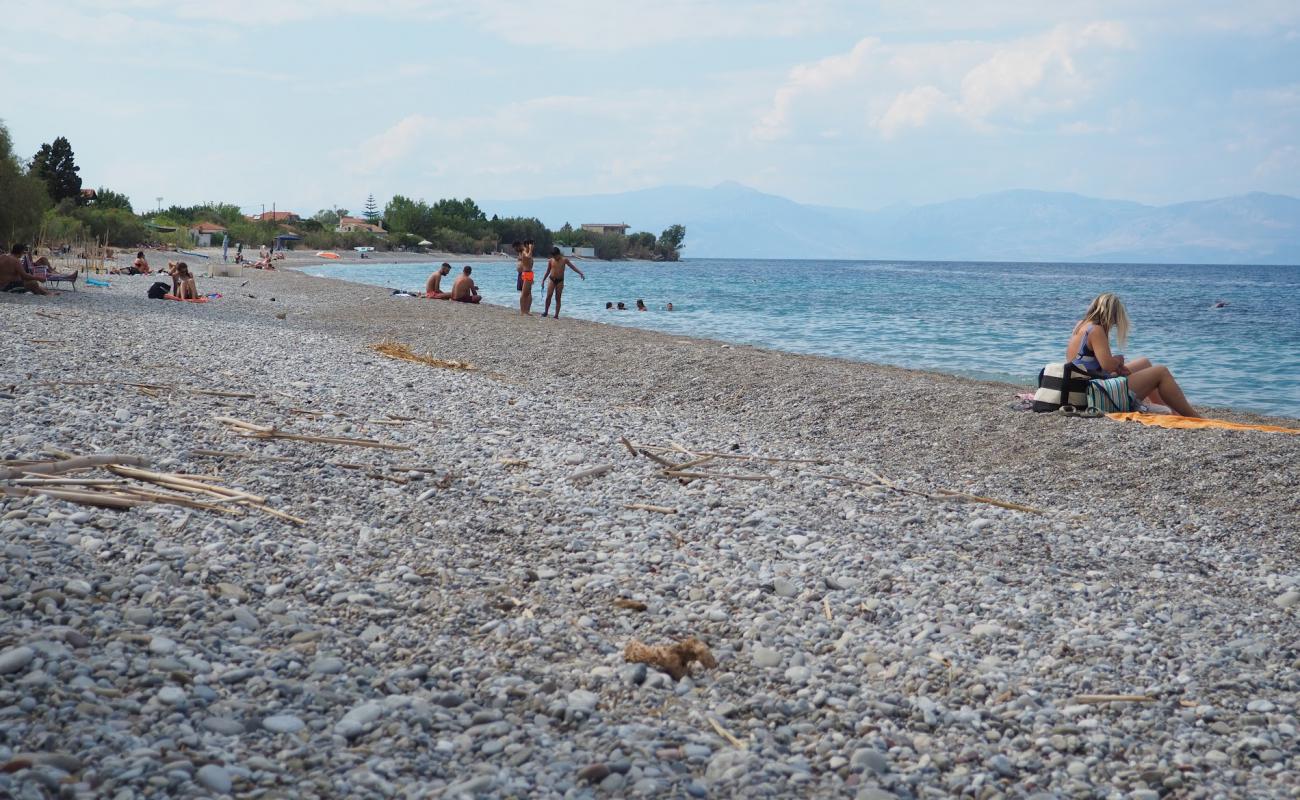 Aigeiras Beach'in fotoğrafı gri çakıl taşı yüzey ile