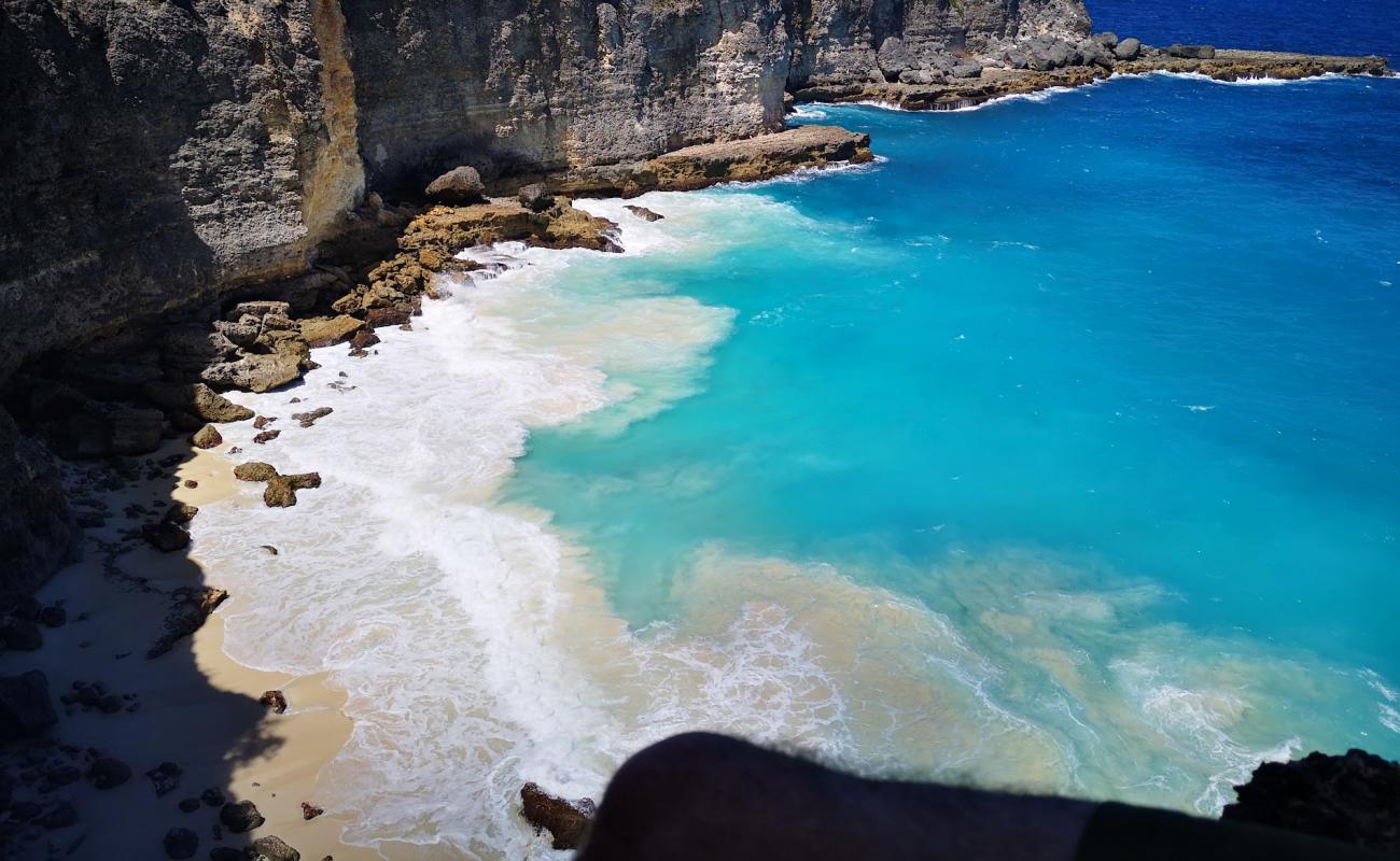 Anse a Tortue'in fotoğrafı bej kum ve kayalar yüzey ile