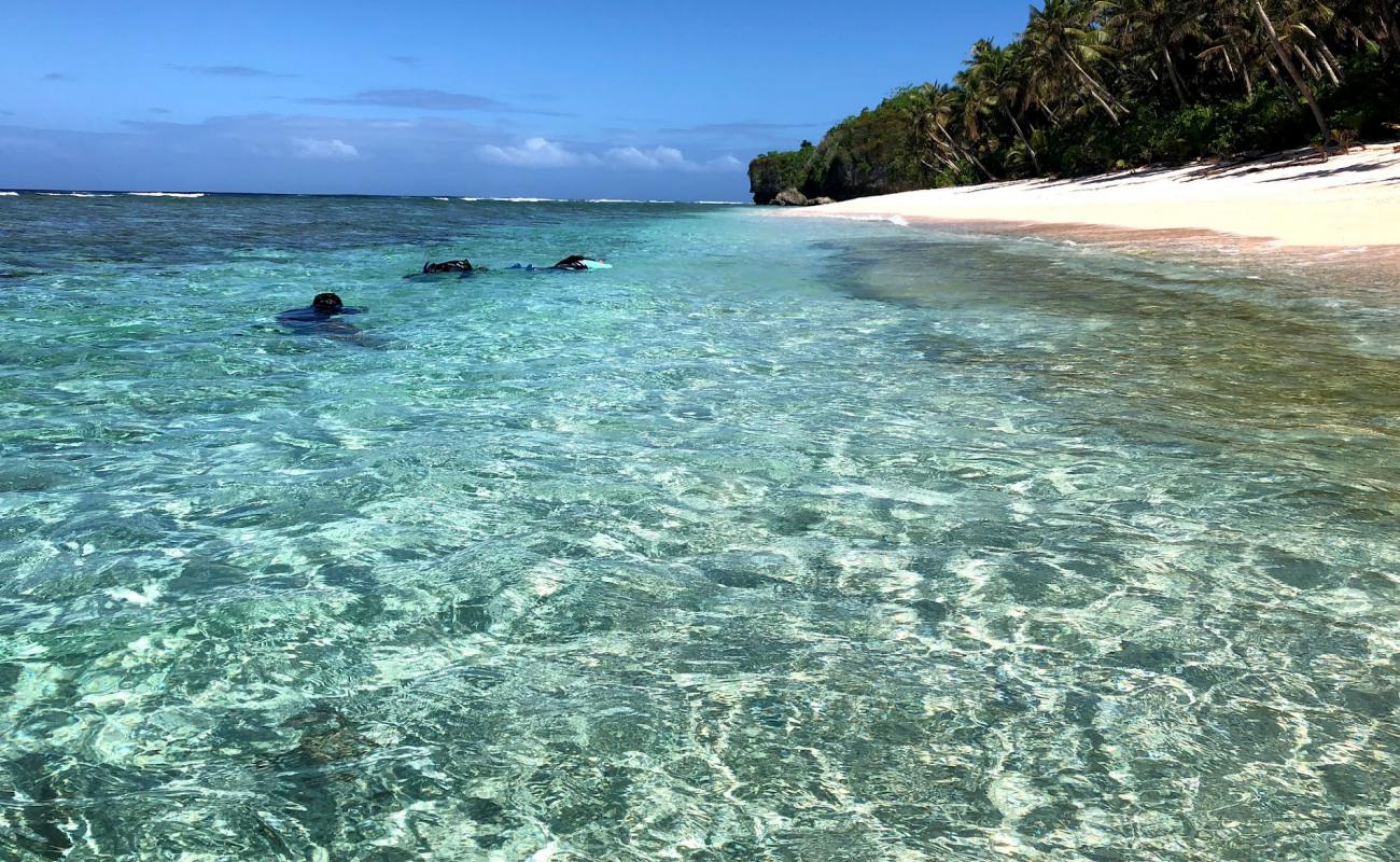 Star sand beach'in fotoğrafı parlak kum yüzey ile