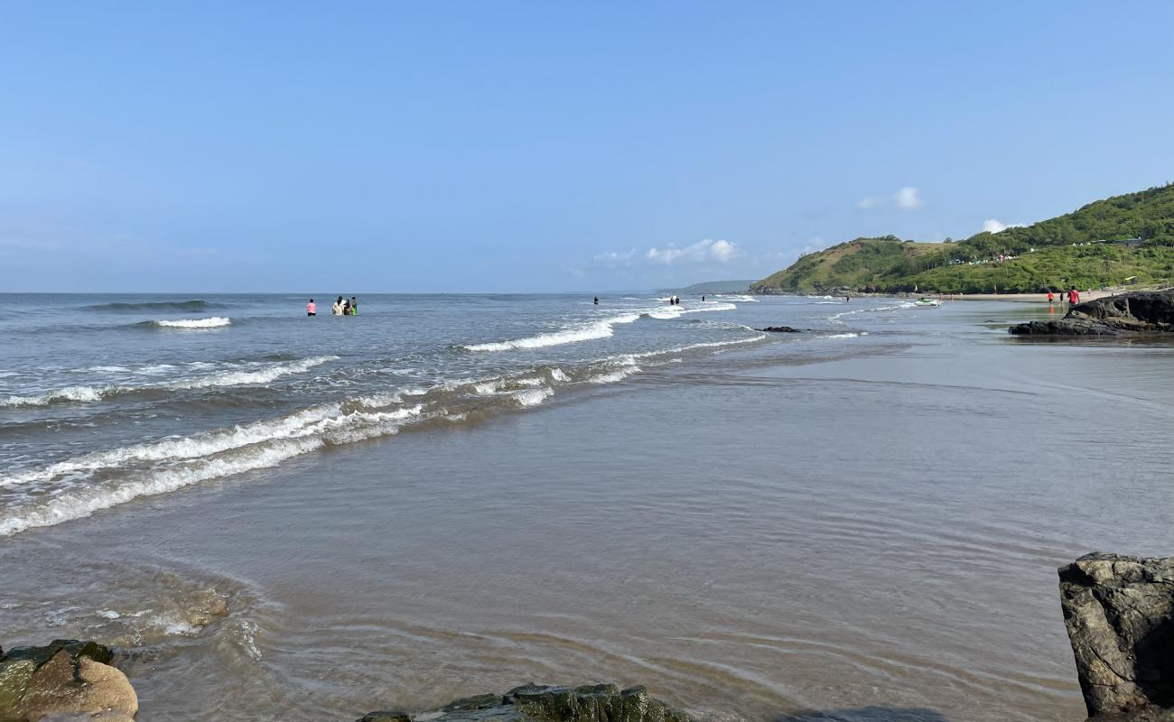 Vagator Beach'in fotoğrafı açık bej kum yüzey ile