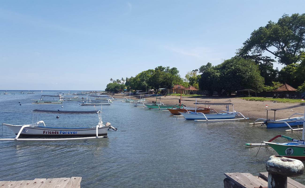 Ganesha Beach'in fotoğrafı kahverengi kum yüzey ile