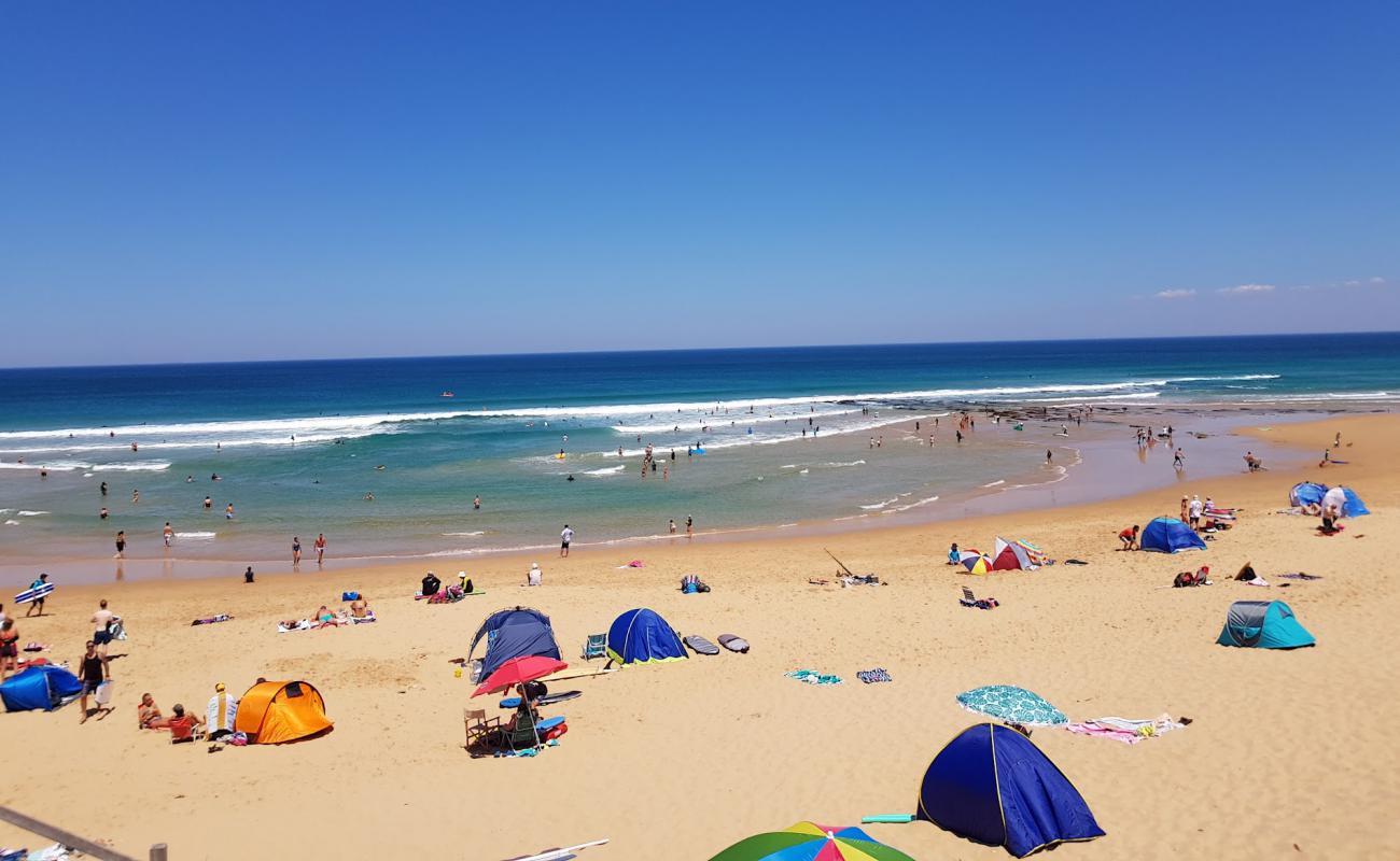 Gunnamatta Ocean Beach'in fotoğrafı parlak kum yüzey ile