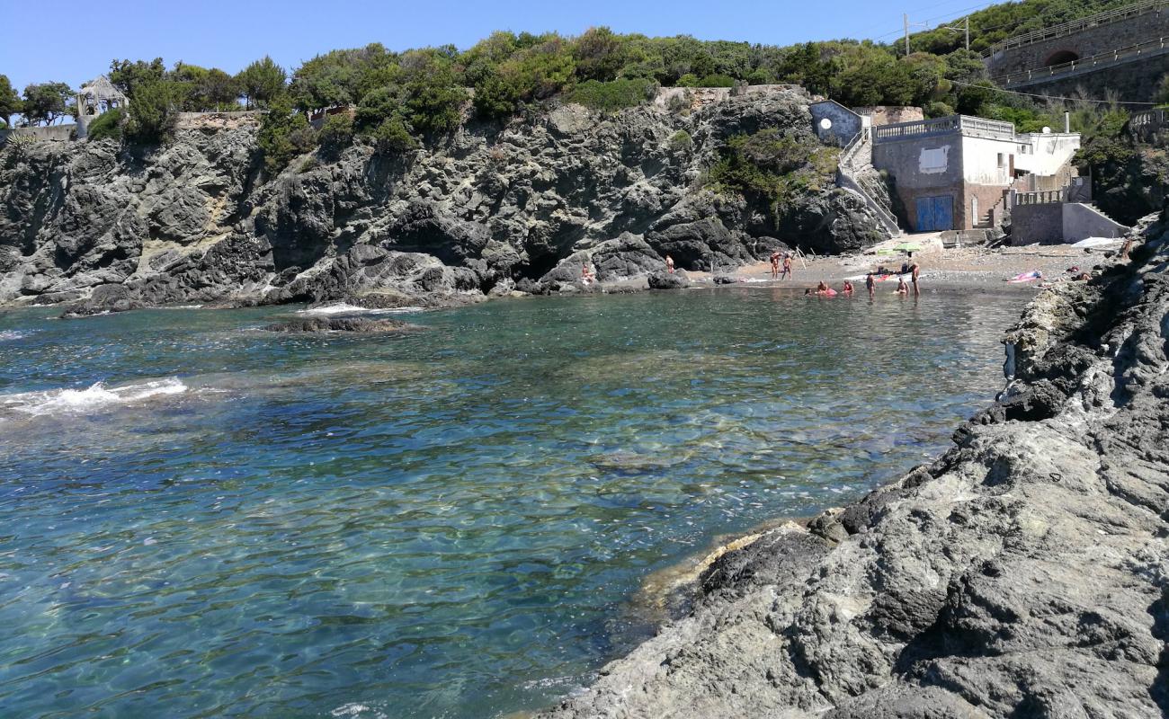 Spiaggia d'Oro'in fotoğrafı taşlı kum yüzey ile