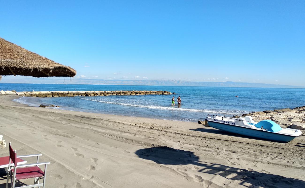 Caribe Beach'in fotoğrafı kahverengi kum yüzey ile