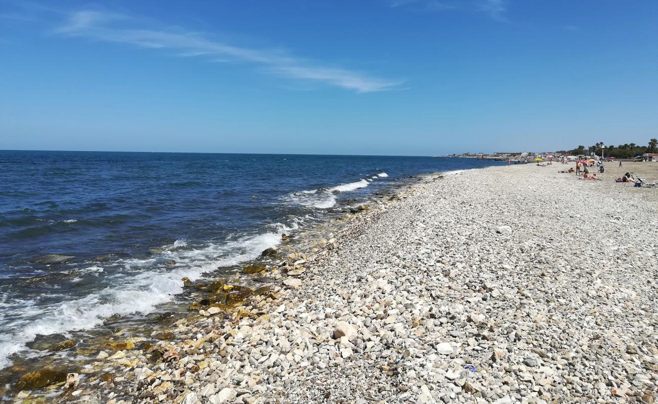 Torre Quetta beach'in fotoğrafı gri çakıl taşı yüzey ile