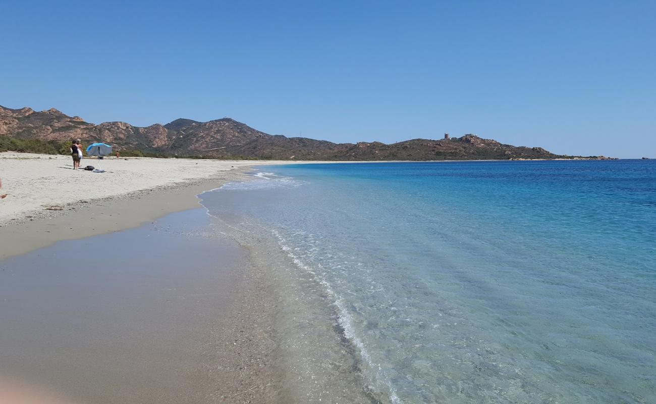 Porto Corallo'in fotoğrafı i̇nce bej kum yüzey ile