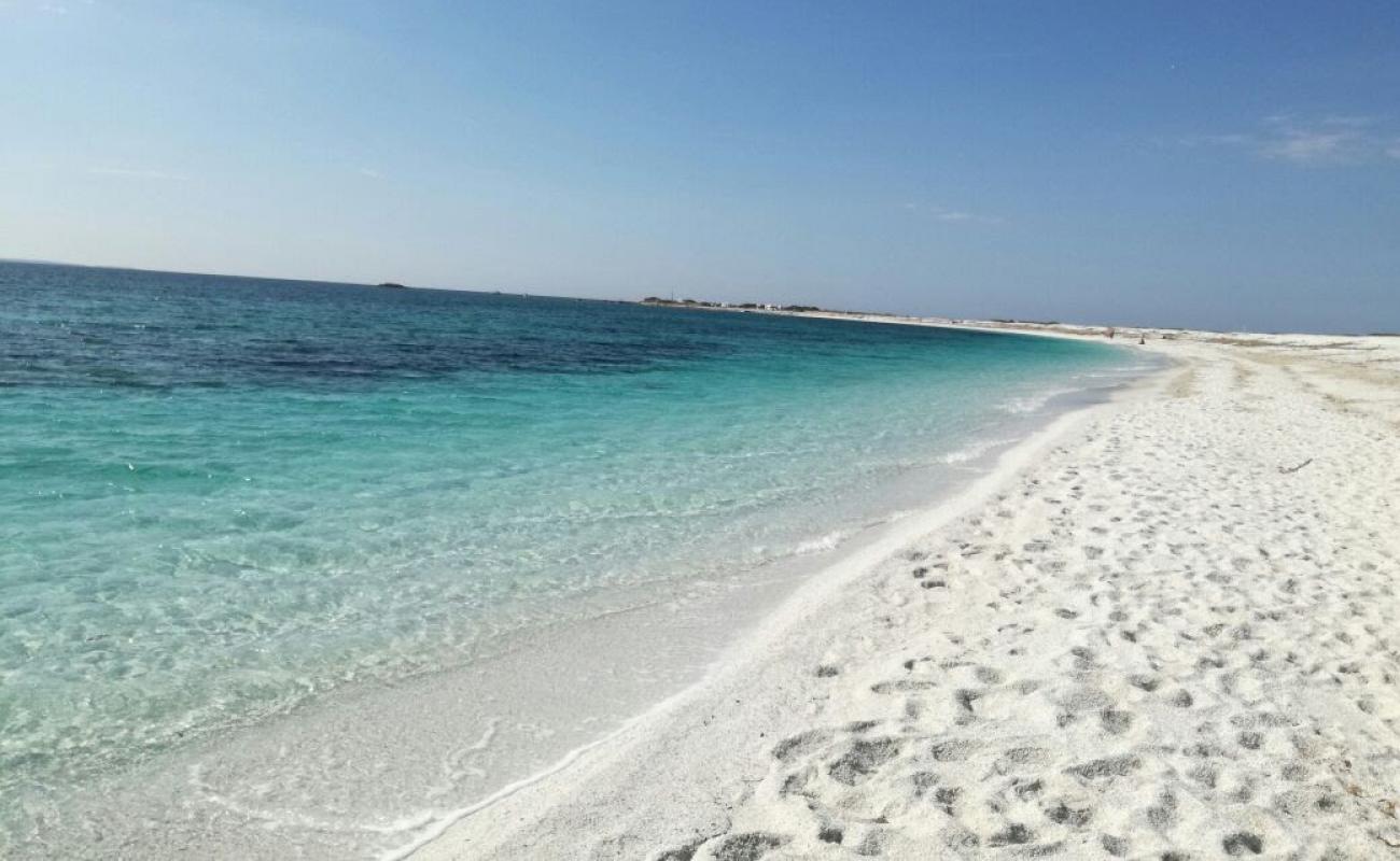 Spiaggia di Portu S'Uedda'in fotoğrafı parlak kum yüzey ile