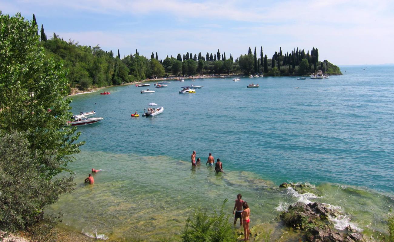 Spiaggia Baia delle Sirene'in fotoğrafı kayalık arazi yüzey ile