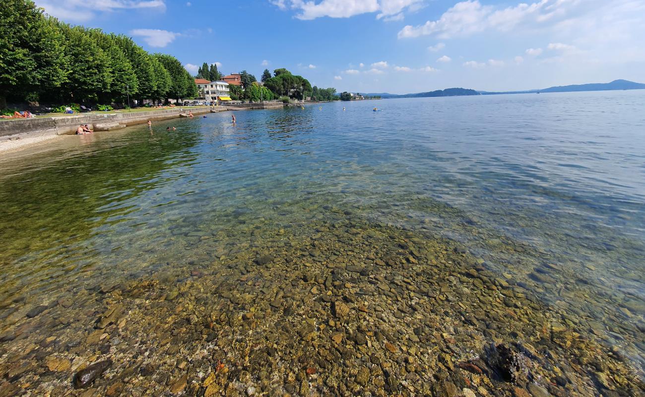 Spiaggia di Arolo'in fotoğrafı parlak kum ve kayalar yüzey ile