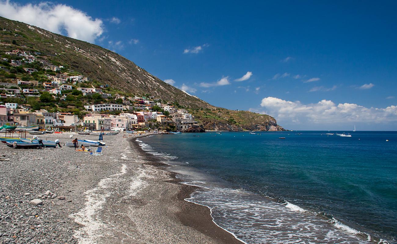 Coral Beach, Canneto'in fotoğrafı kara çakıl taş yüzey ile