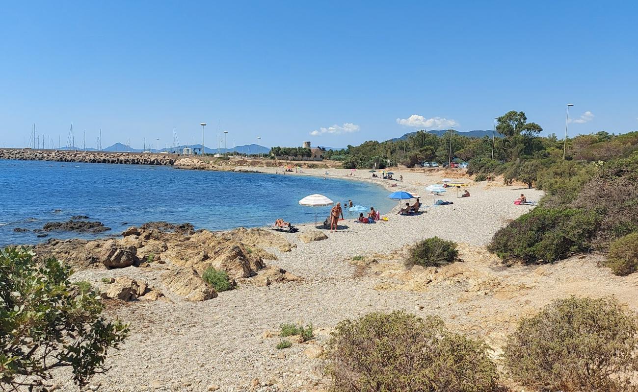Porto Corallino Beach'in fotoğrafı küçük bej çakıl yüzey ile
