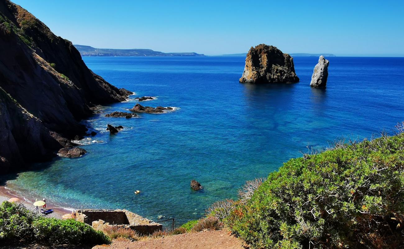 Porto Banda Beach'in fotoğrafı bej kum ve çakıl yüzey ile