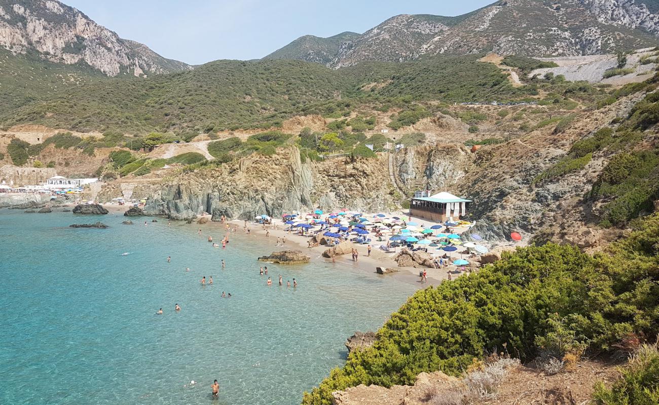Porto Cauli Beach'in fotoğrafı açık bej kum yüzey ile