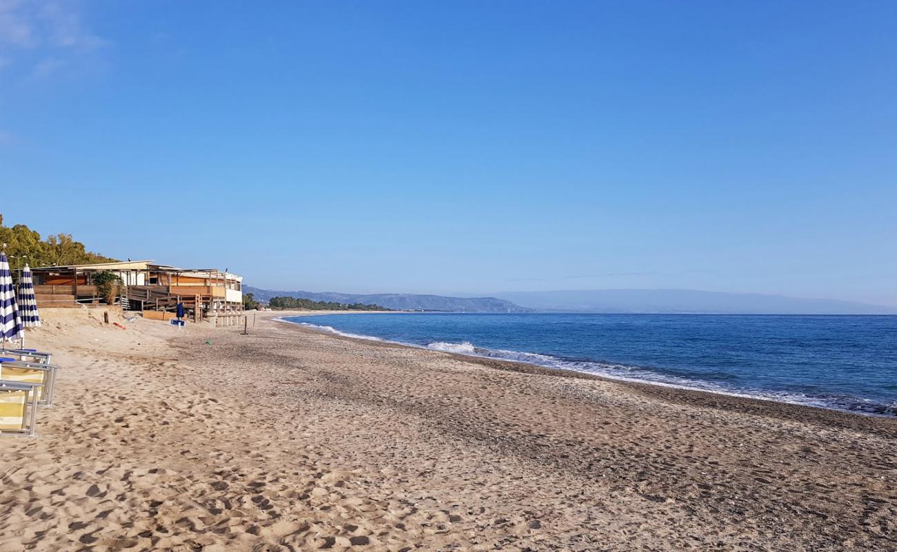 Santandrea Beach'in fotoğrafı açık bej kum yüzey ile