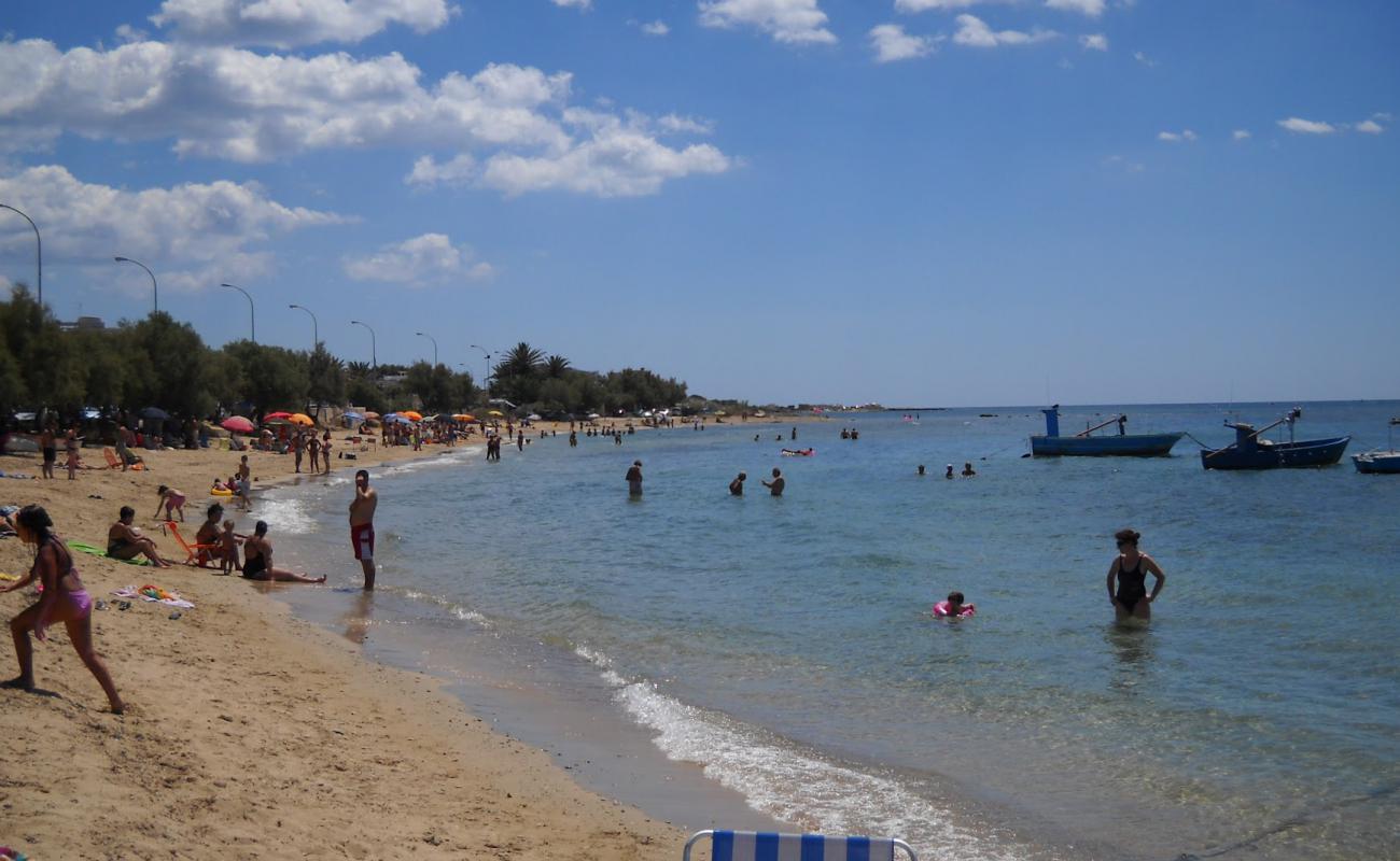 Torre Ovo Beach'in fotoğrafı bej kum ve çakıl yüzey ile