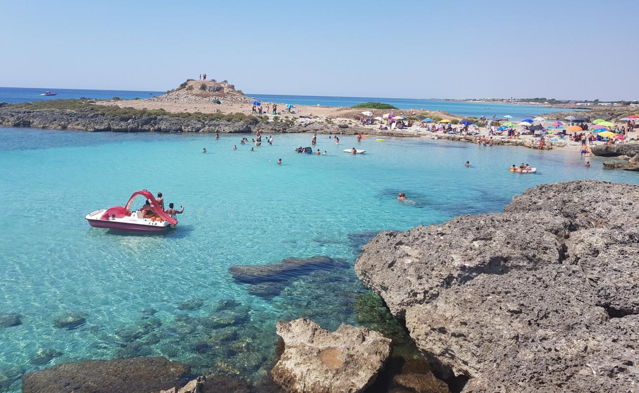 Torre Castiglione Beach'in fotoğrafı kayalık arazi yüzey ile