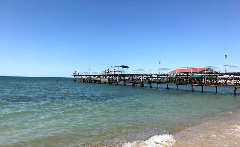 Stigl Beach'in fotoğrafı parlak kum yüzey ile