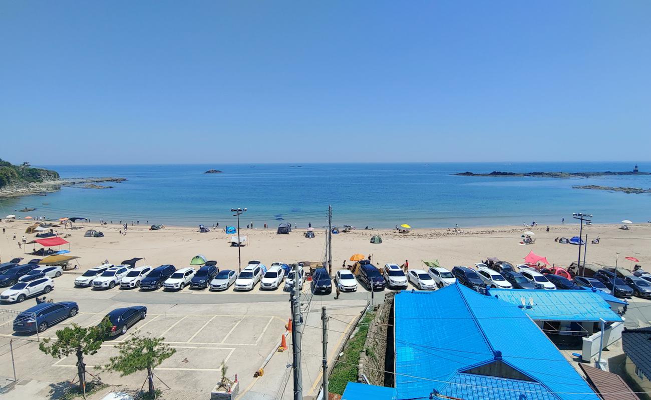 Odo 1-ri Beach'in fotoğrafı parlak kum yüzey ile