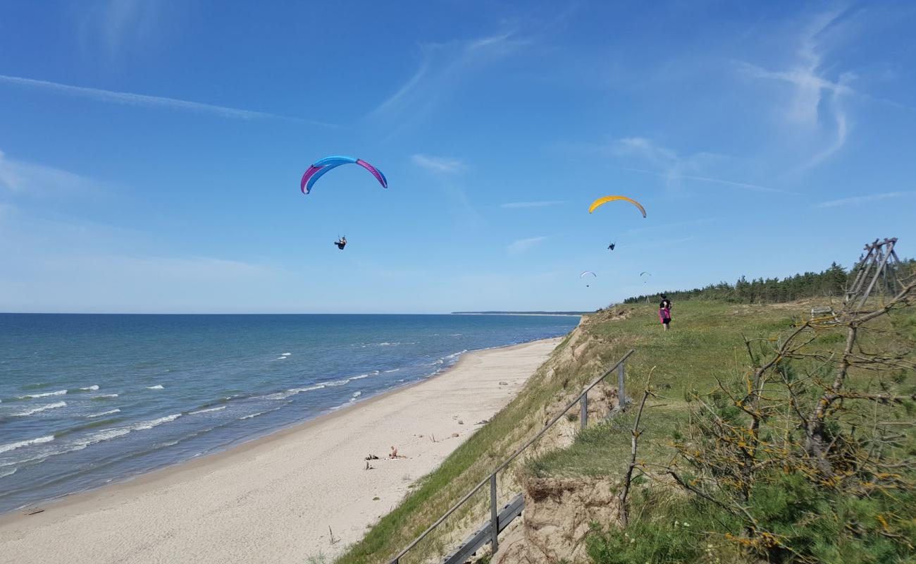 Cerini beach'in fotoğrafı açık bej kum yüzey ile