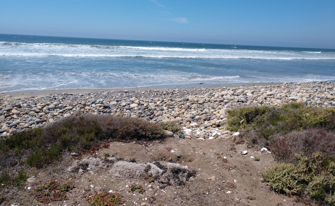 Playa El Socorrito'in fotoğrafı siyah kum ve çakıllar yüzey ile
