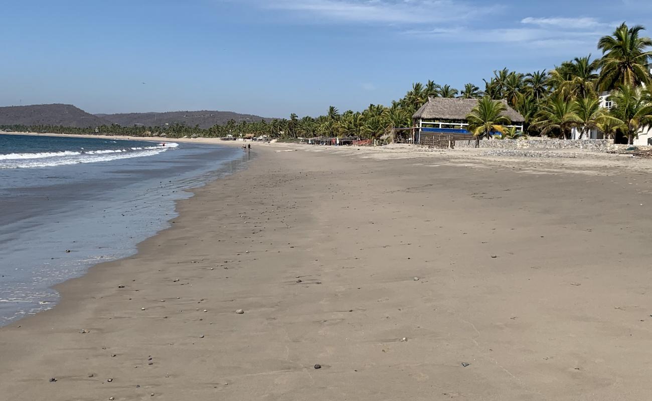 Playa La Manzanilla'in fotoğrafı i̇nce kahverengi kum yüzey ile