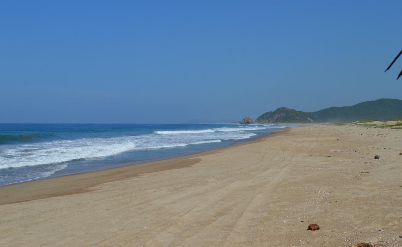 Playa el Coco'in fotoğrafı kahverengi kum yüzey ile