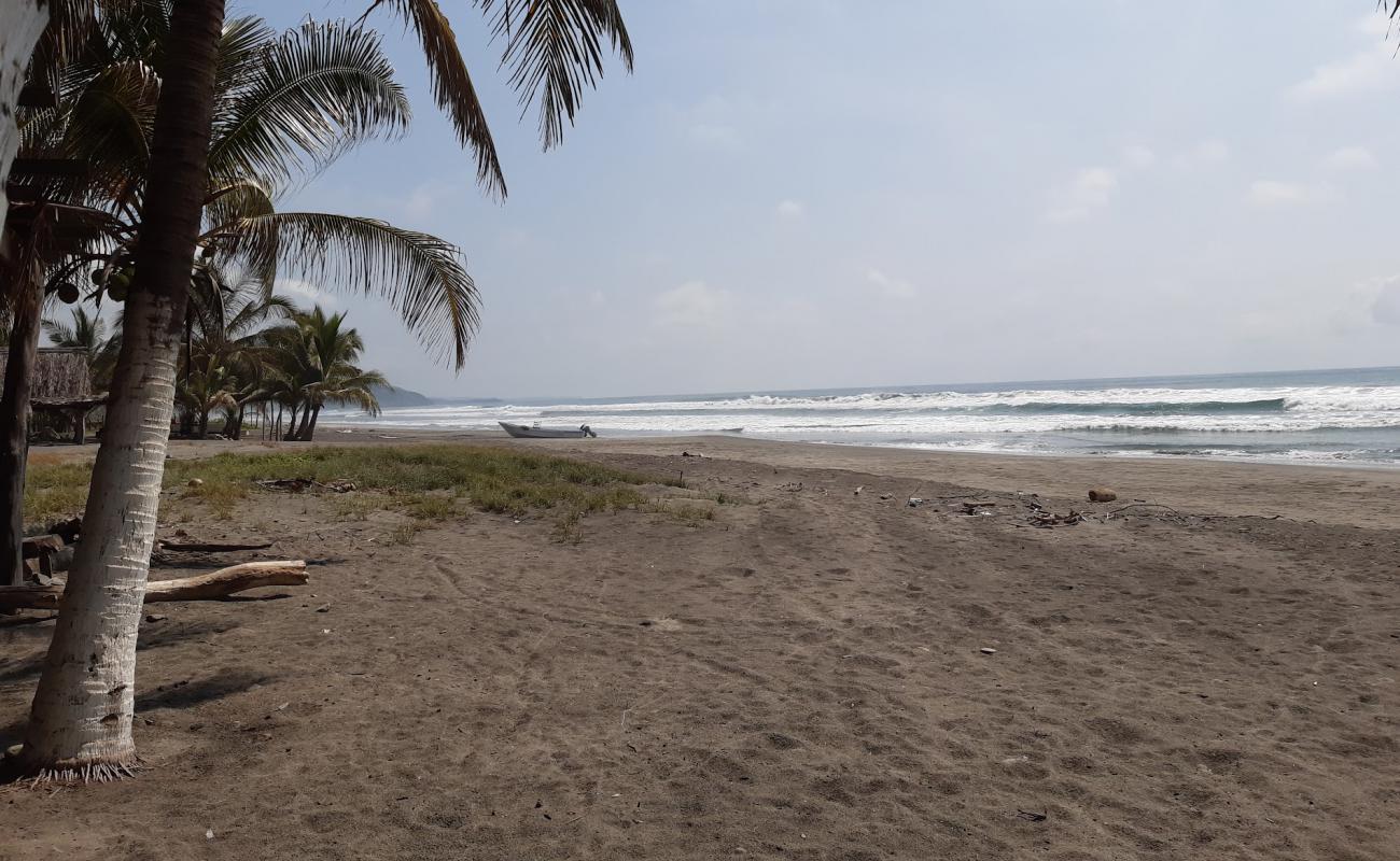 Playa La Placita'in fotoğrafı kahverengi kum yüzey ile