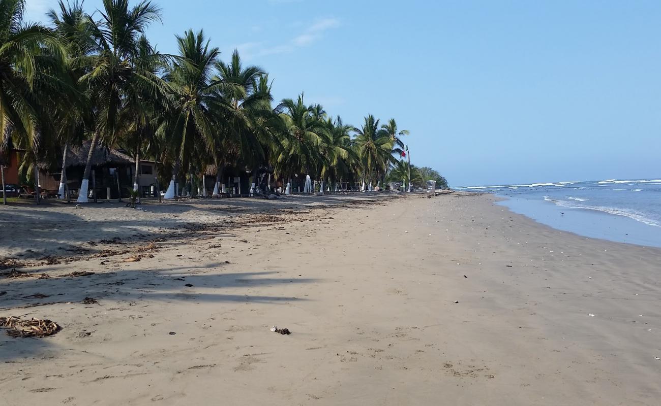 Playa La Saladita'in fotoğrafı kahverengi kum yüzey ile
