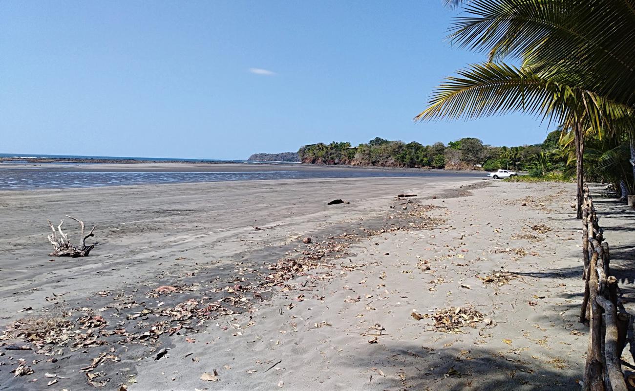 Playa Arrimadero'in fotoğrafı bej kum ve kayalar yüzey ile