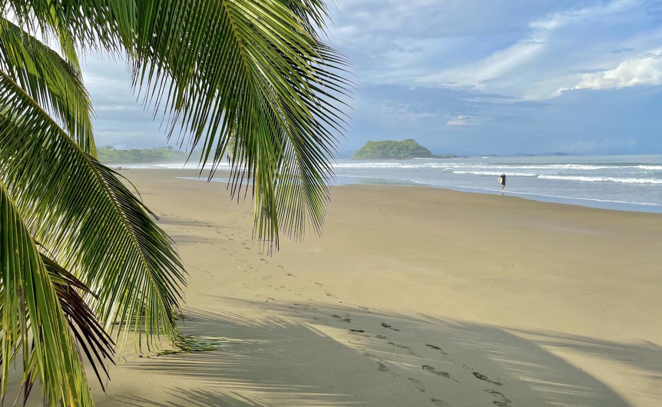 Morrillo Beach'in fotoğrafı kahverengi kum yüzey ile