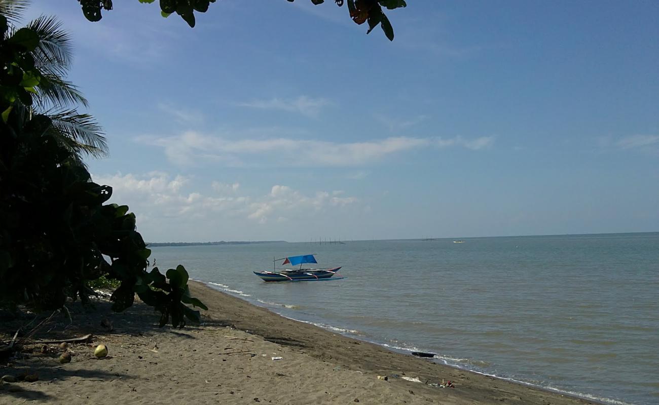 Paco Beach'in fotoğrafı gri kum yüzey ile