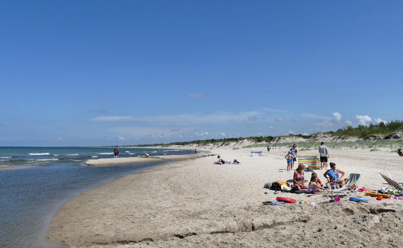 Naturystyczna Beach'in fotoğrafı parlak kum yüzey ile