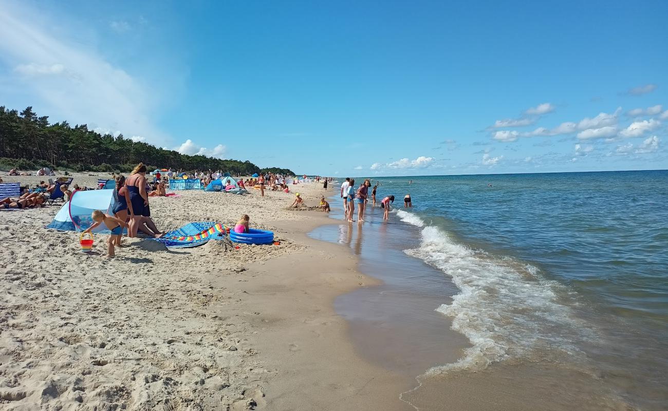 Ostrowo Beach'in fotoğrafı açık bej kum yüzey ile