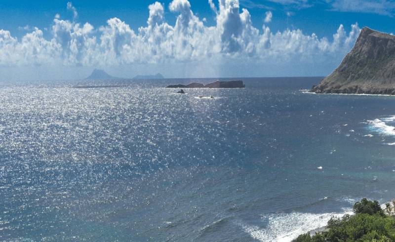 Toiny Bay beach'in fotoğrafı açık bej kum yüzey ile