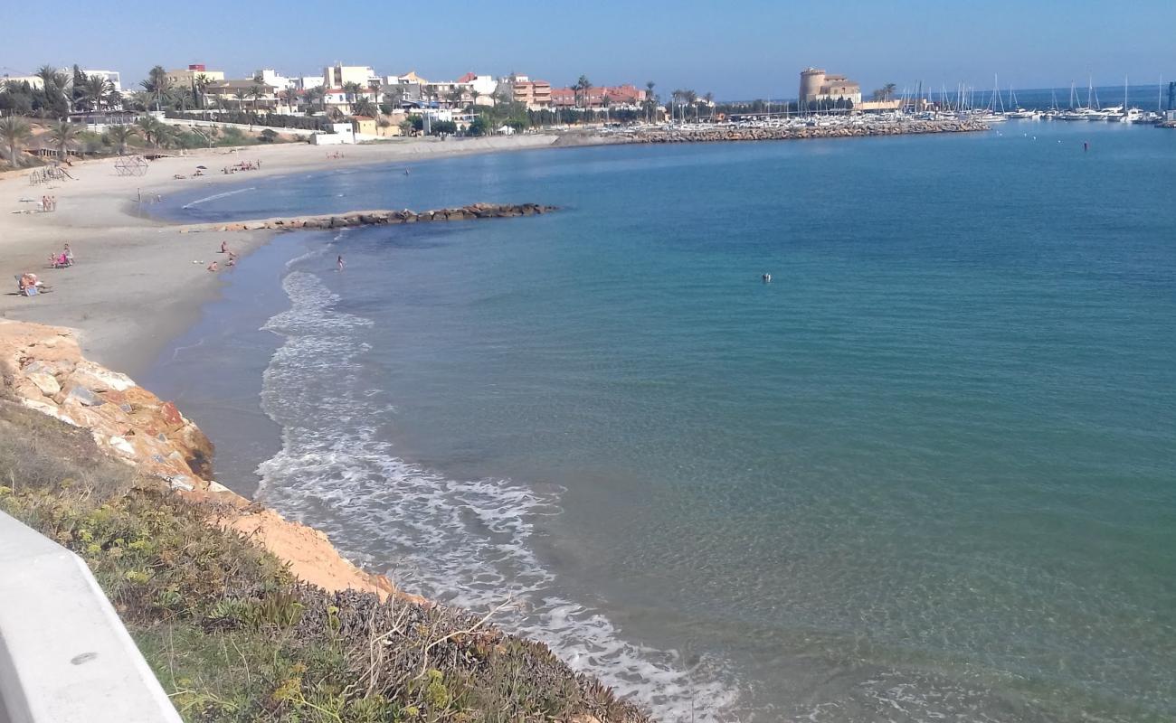 Playa del Puerto'in fotoğrafı parlak kum yüzey ile