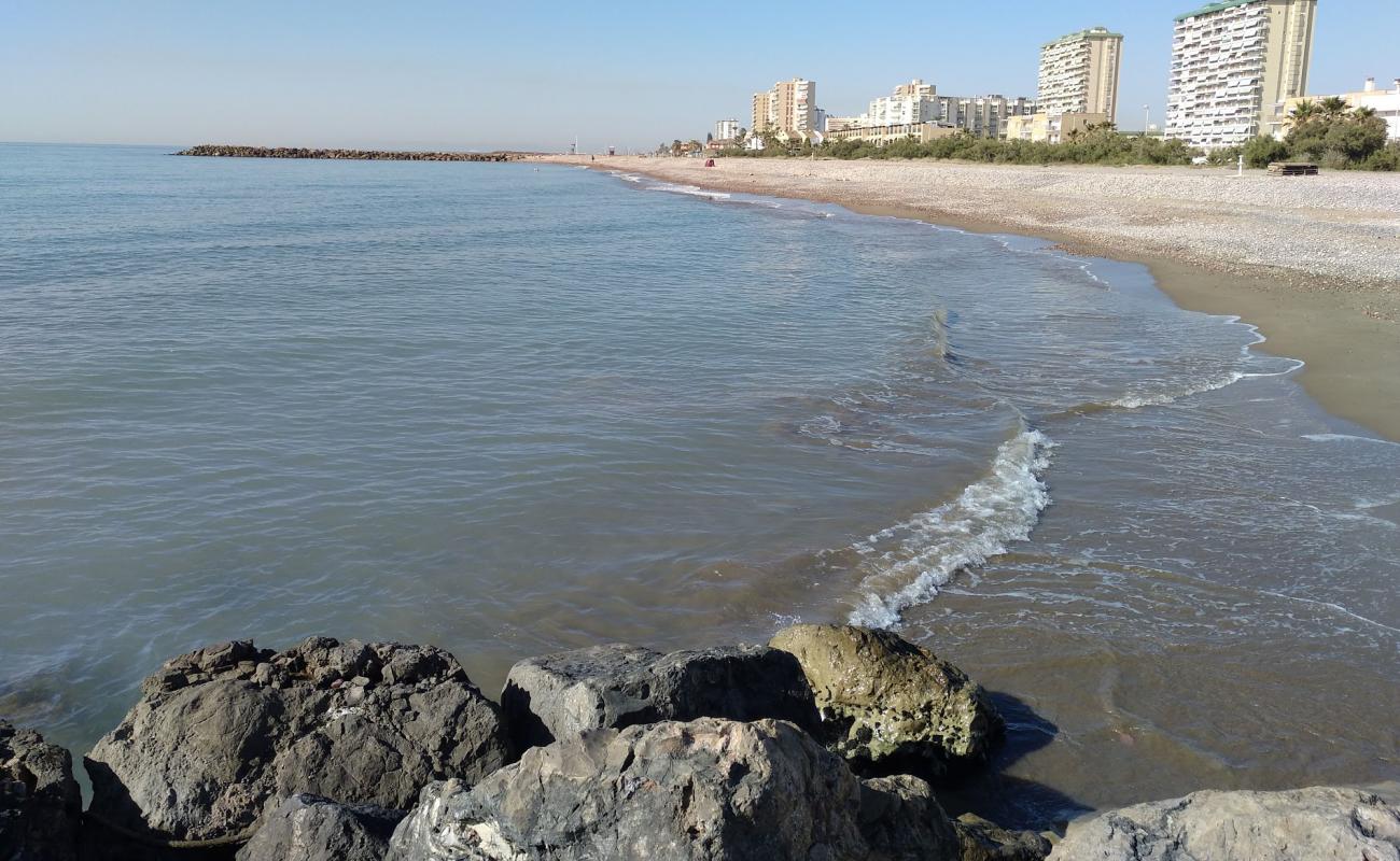 Puig Plajı'in fotoğrafı siyah kum ve çakıllar yüzey ile