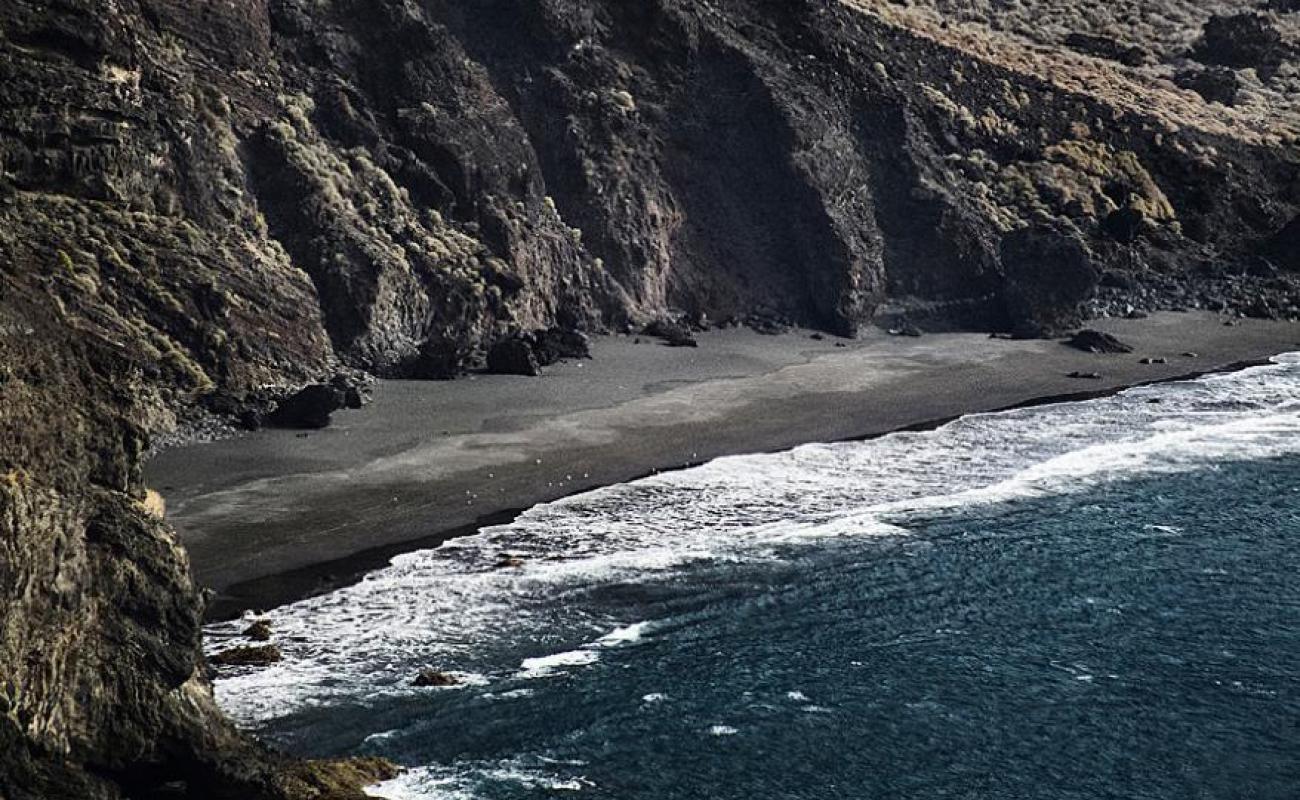 Playa de Heredia'in fotoğrafı gri çakıl taşı yüzey ile