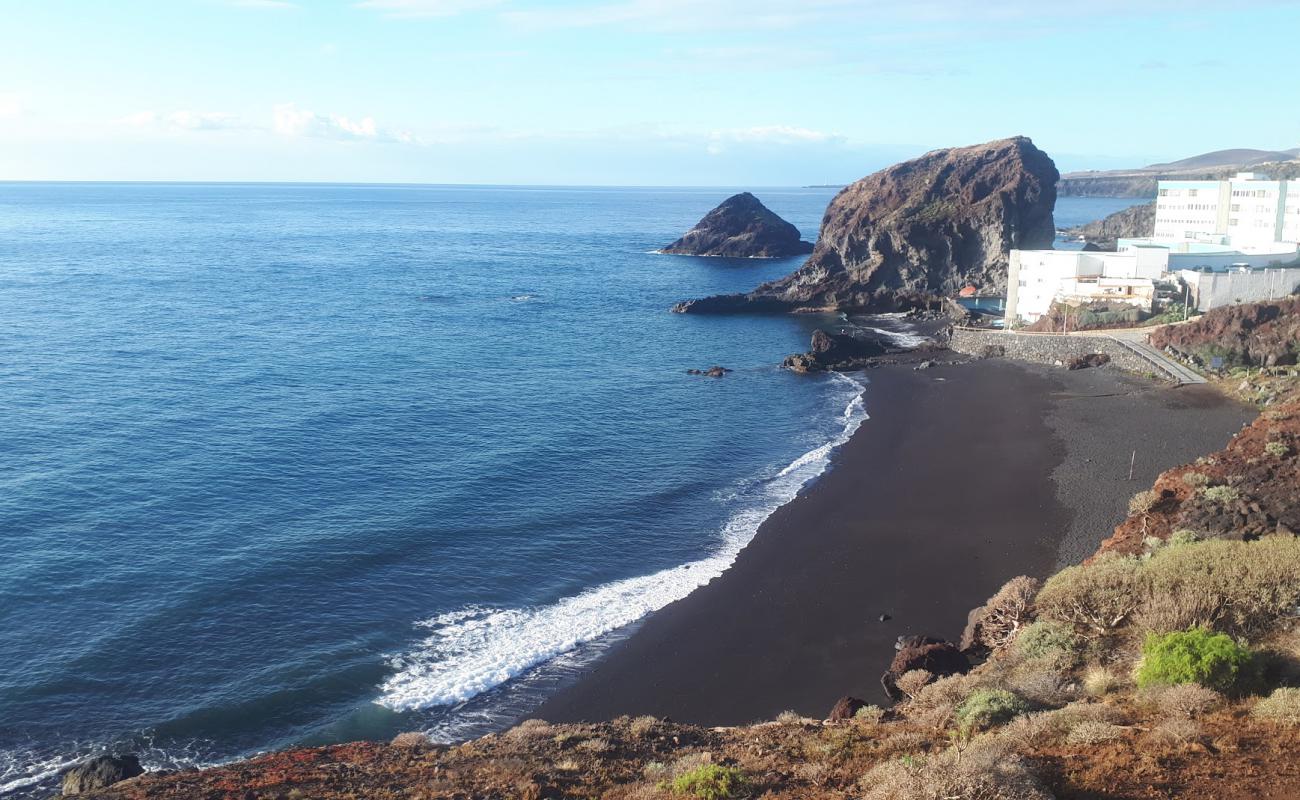 Playa del Abrigo'in fotoğrafı gri kum yüzey ile