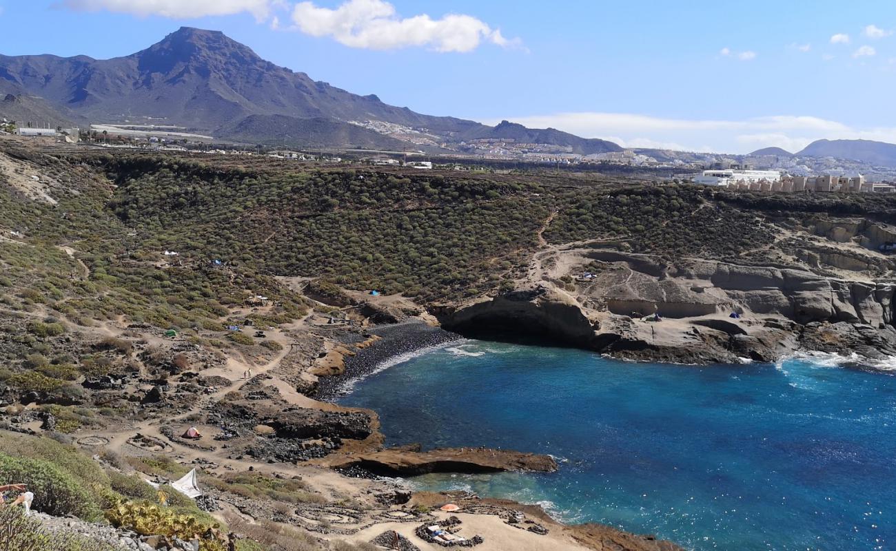 Playa de los Morteros'in fotoğrafı gri kum ve çakıl yüzey ile