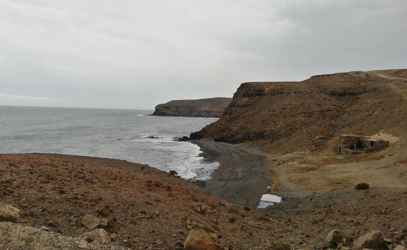 Playa Majada de las Cabras'in fotoğrafı taşlı kum yüzey ile
